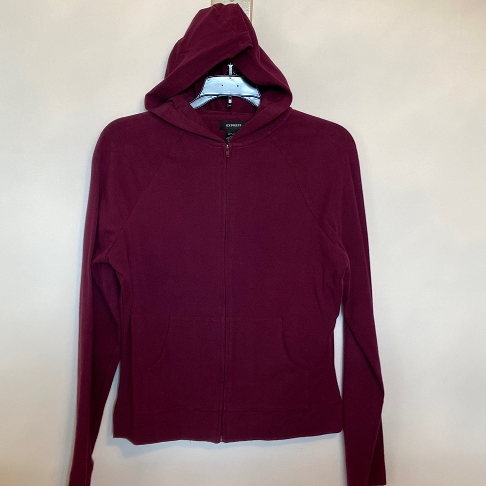 Express plum colored hooded zipped jacket with two front pouch pockets. Size M